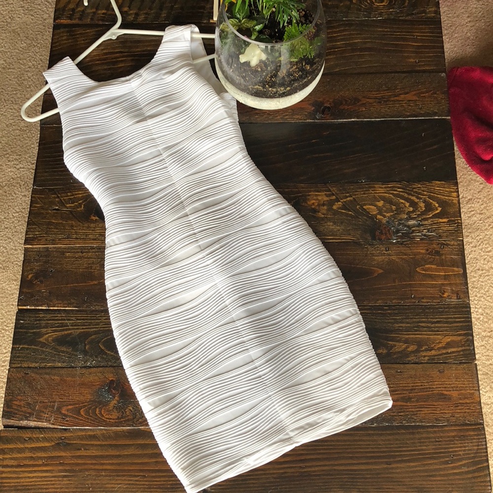 White body fitting dress.